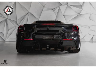 Luxury black Ferrari sports car with sleek design and advanced aerodynamics at Inspired Autosport showroom, perfect for car enthusiasts and high-speed enthusiasts.