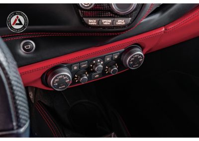 High-quality automotive climate control with Ducat interface in a luxury sports car interior.