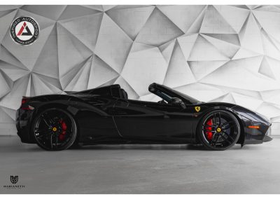 Elegant black Ferrari convertible with red brake calipers, showcasing premium sports car craftsmanship, ideal for automotive enthusiasts and luxury car collectors.