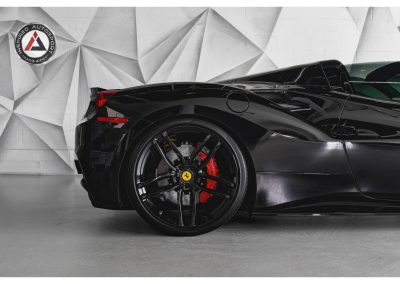 High-resolution image of a sleek black Ferrari sports car showcasing advanced performance and design, perfect for luxury and automotive enthusiasts.