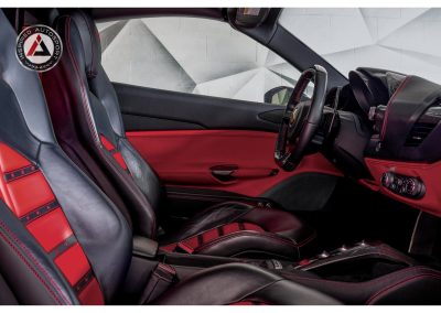 High-quality black and red leather racing seats with enhanced comfort and support.