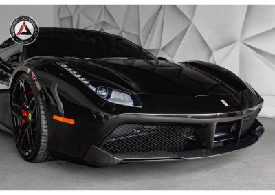 Luxurious black Ferrari sports car with sleek design and high-performance features, perfect for car enthusiasts and racing fans, showcased by Inspired Autosport.