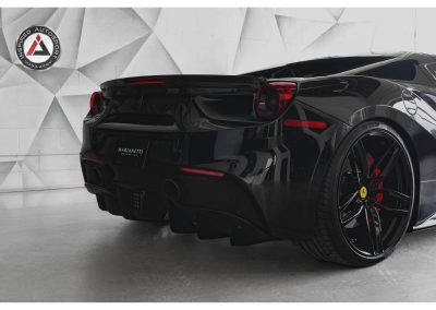 Black Ferrari sports car with sleek design, custom wheels, and high-performance features for automotive enthusiasts.