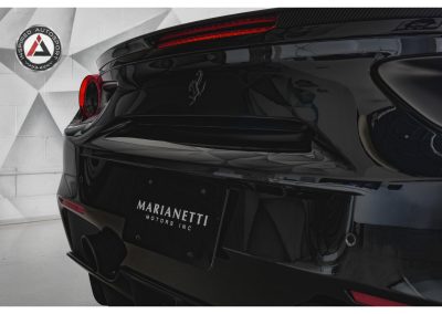 High-quality image of a sleek black Ferrari highlighting its luxurious design and advanced features, ideal for automotive enthusiasts and luxury car collectors.